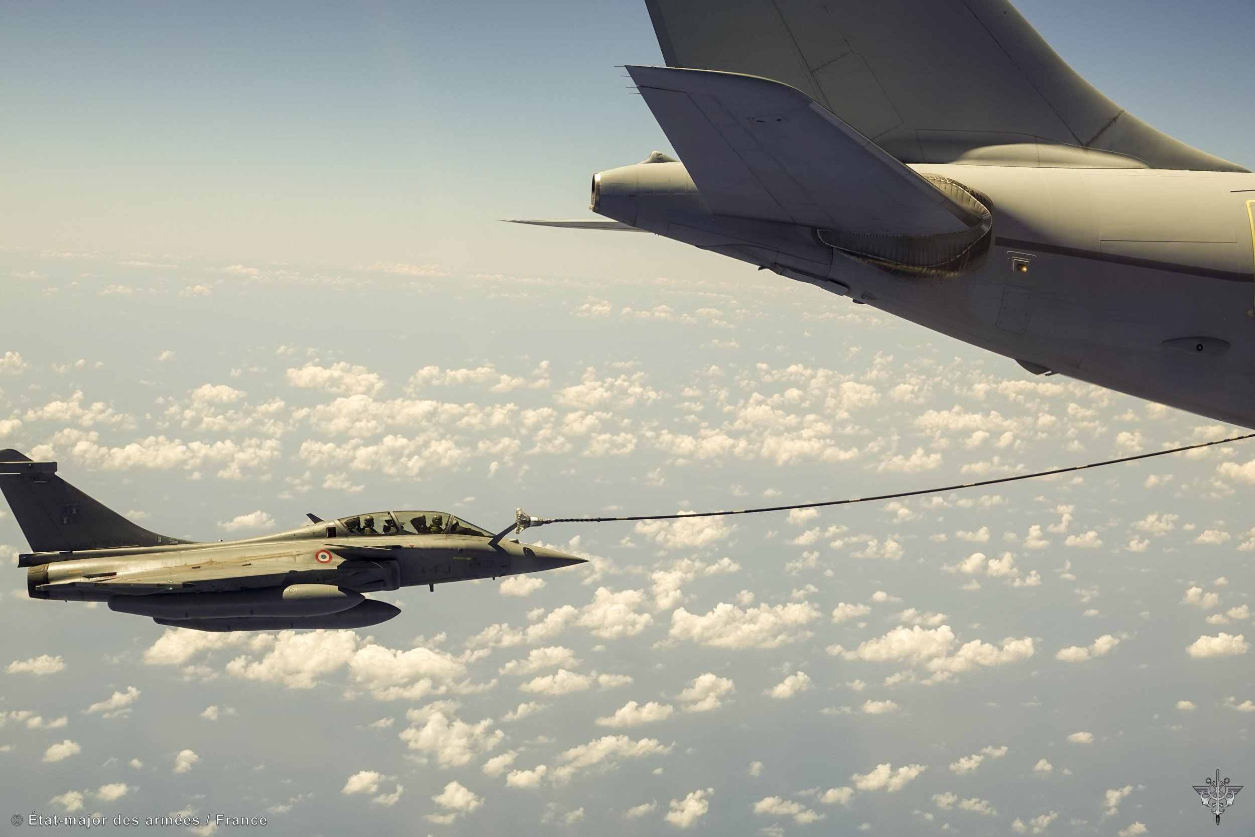 Image shows RAF Typhoon refuelling RAF Voyager in the air.